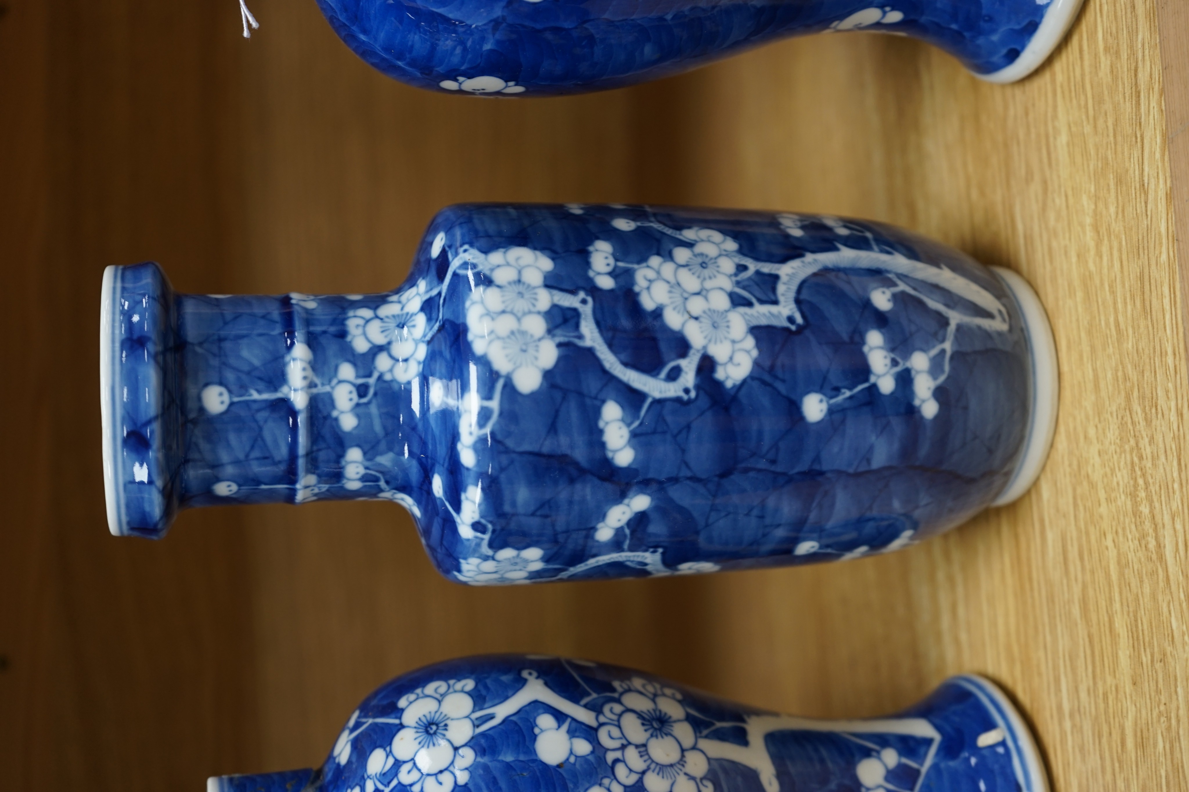 Three Chinese blue and white prunus vases. 25.5cm